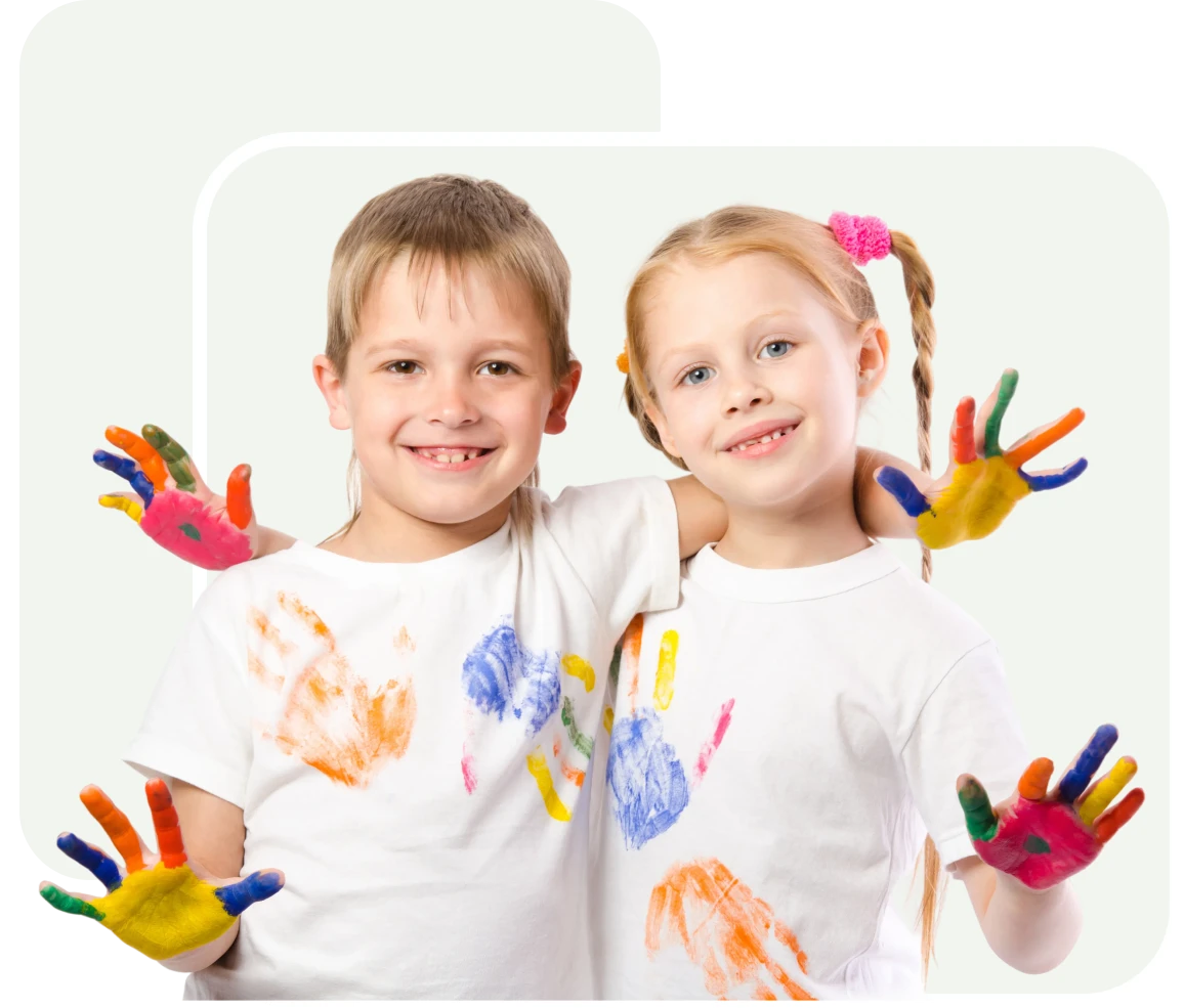 Children with painted hands smiling